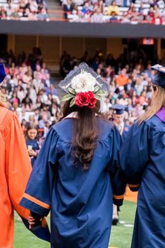 A detailed flower design atop this student's graduation cap. 